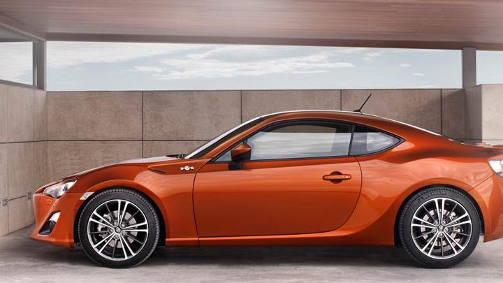 2012 Toyota GT 86 In Orange Side Pose In Garage